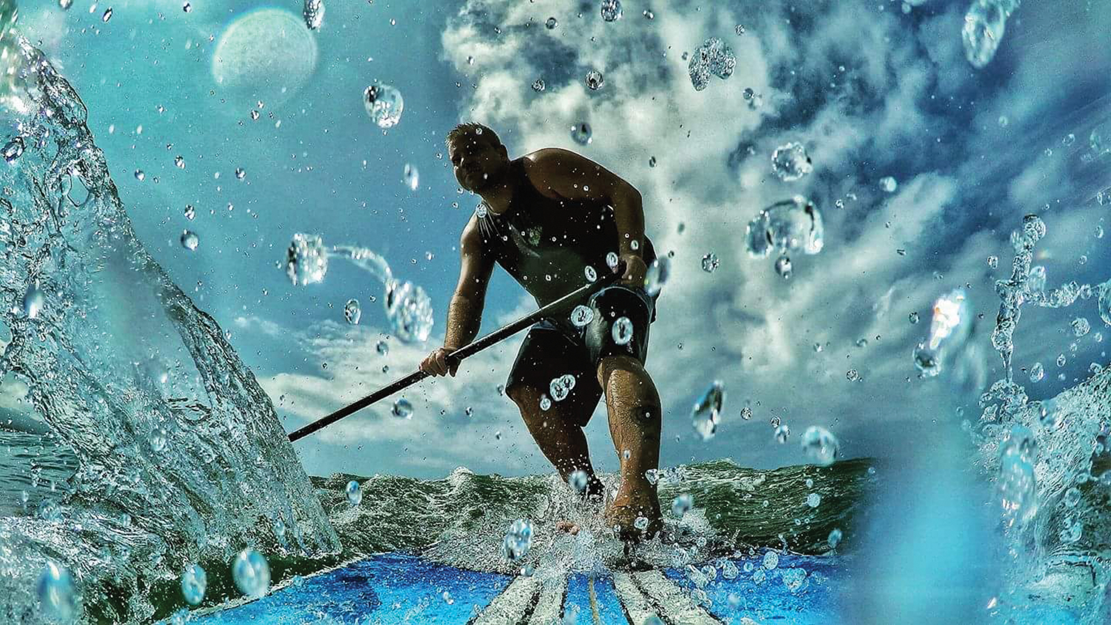 Ryan Smith paddling in ocean