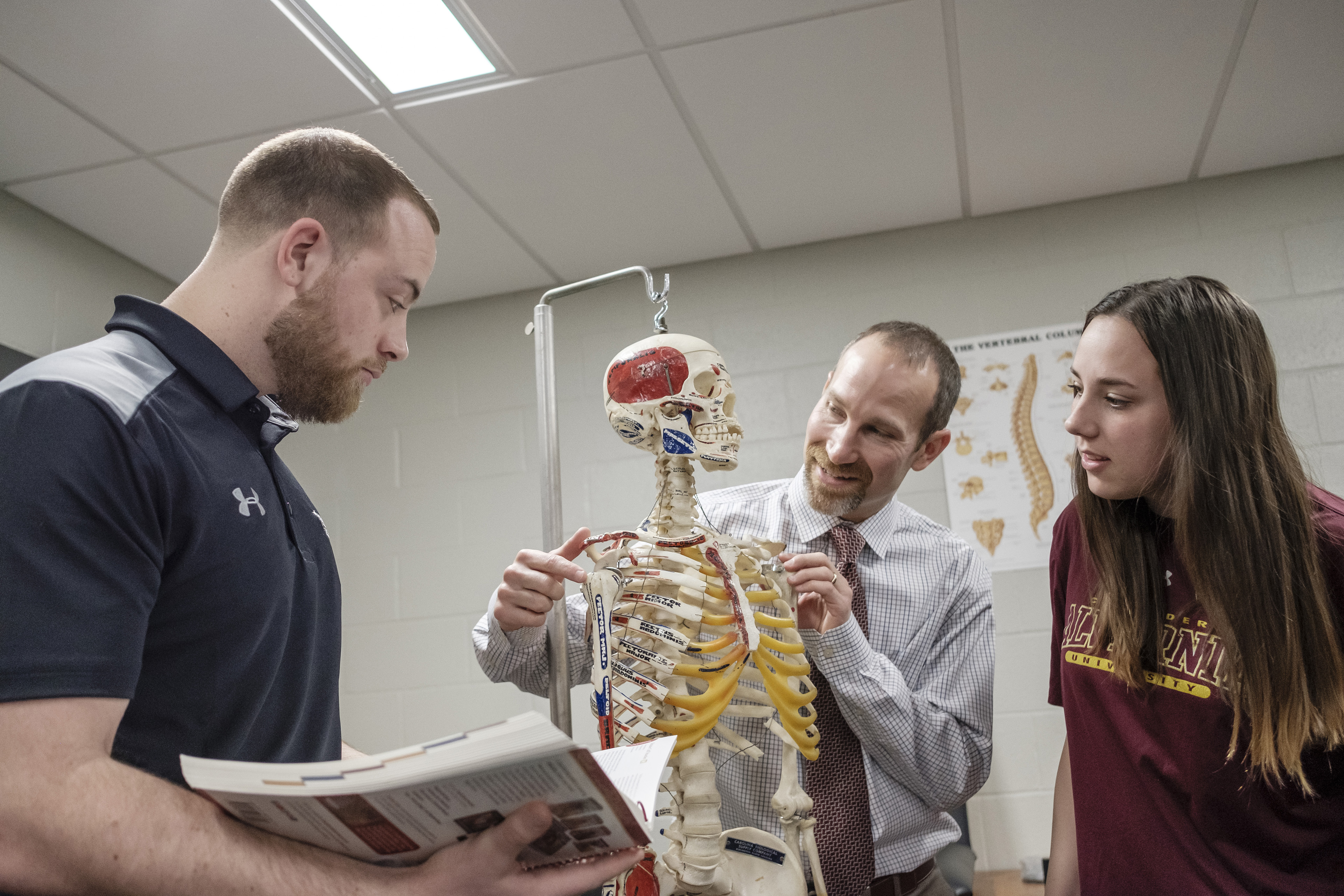 Anatomical identification as part of an orthopedic assessment. Dr. Tom Franek, Department Chair, athletic training students.