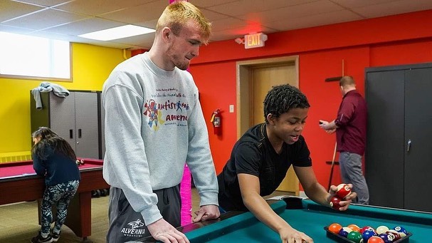 Volunteering playing pool with children