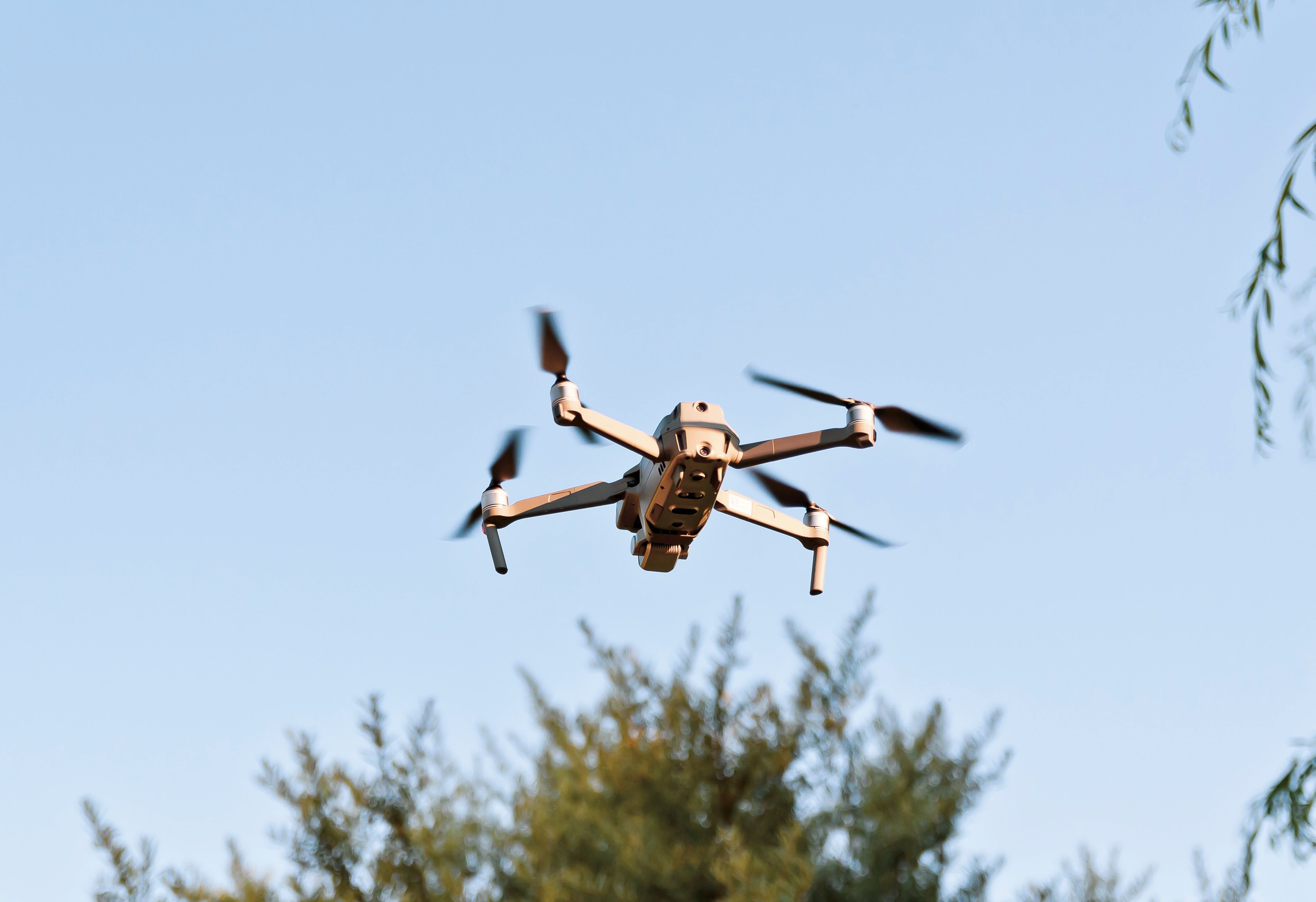 A drone flies in the sky.