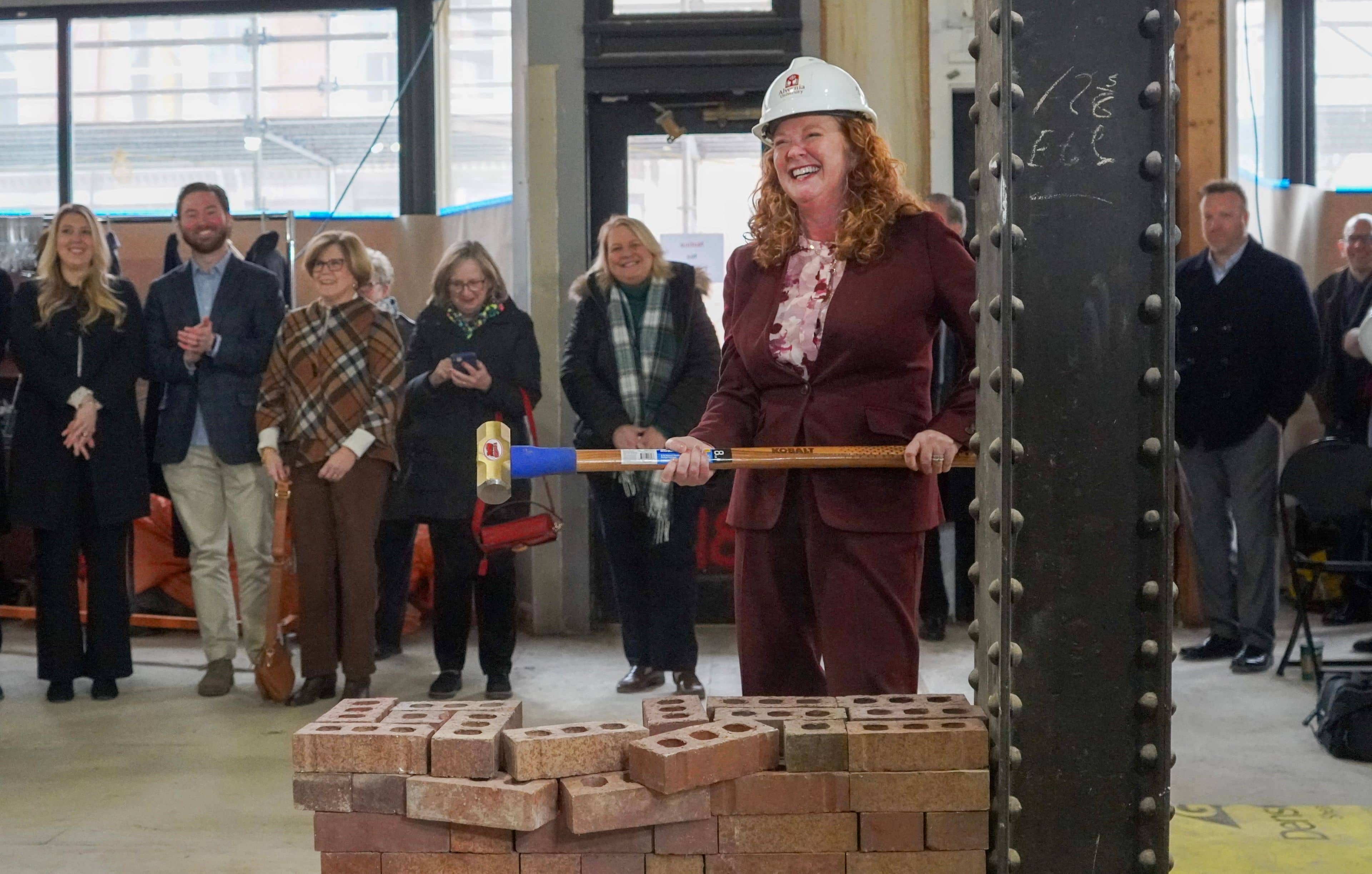 Alvernia President Glynis A. Fitzgerald, Ph.D. breaks ground on the American House at Reading CollegeTowne