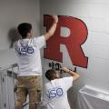 Volunteers paint murals at Reading High
