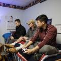 Students playing video games in dorm room