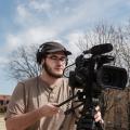 A student shoots video on campus.