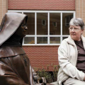 Sister Bridget looking at statue