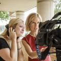 Professor teaches student to use video equipment