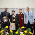 Dr. Flynn poses for a photo with honorees 