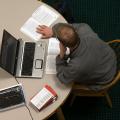 male online student with laptop