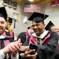 Alvernia students Jacob Paul-Taylor and Tyzhir Morris celebrate at the 2022 Alvernia University Commencement Ceremony
