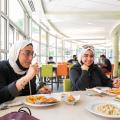 International Student having lunch in the dining hall