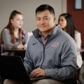 Graduate student studying in lounge