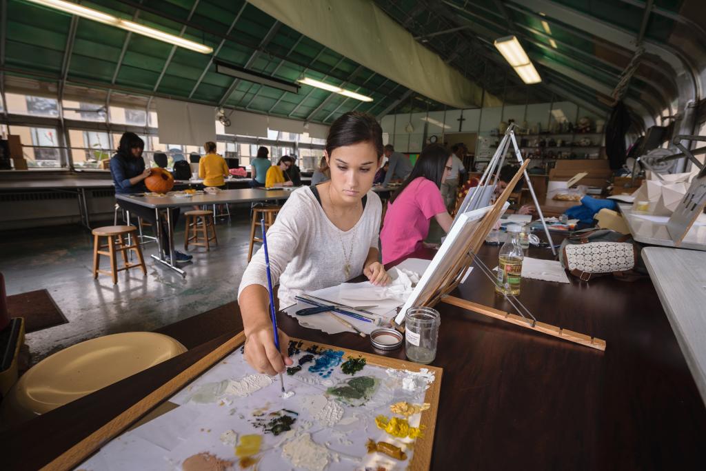 Student creating artwork