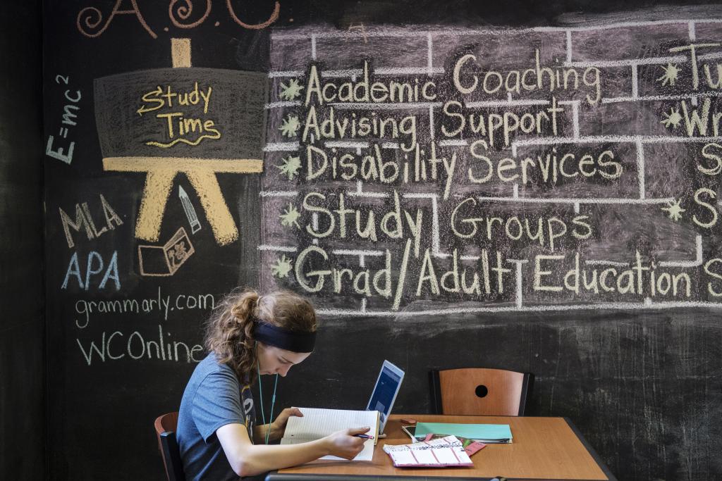 Student uses Bernardine Hall lounge to study