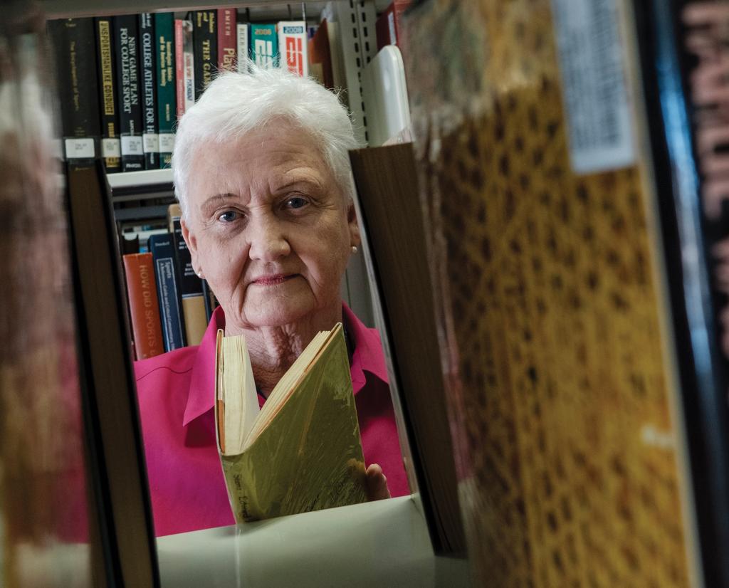 Beth DeMeo in library stacks