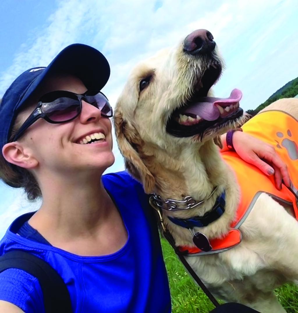 Alumna Camille Otruba with her dog Indy