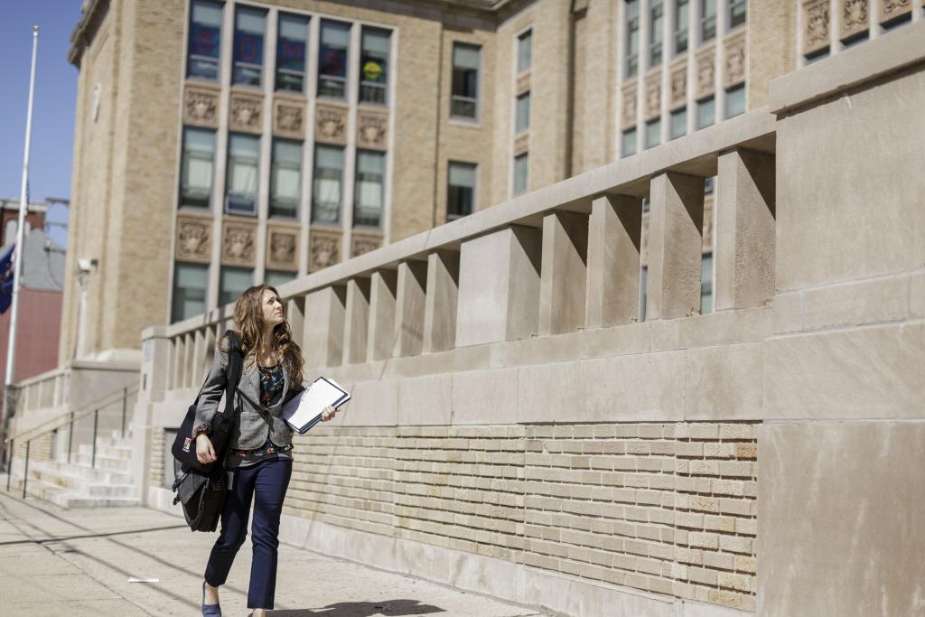 Student in downtown reading