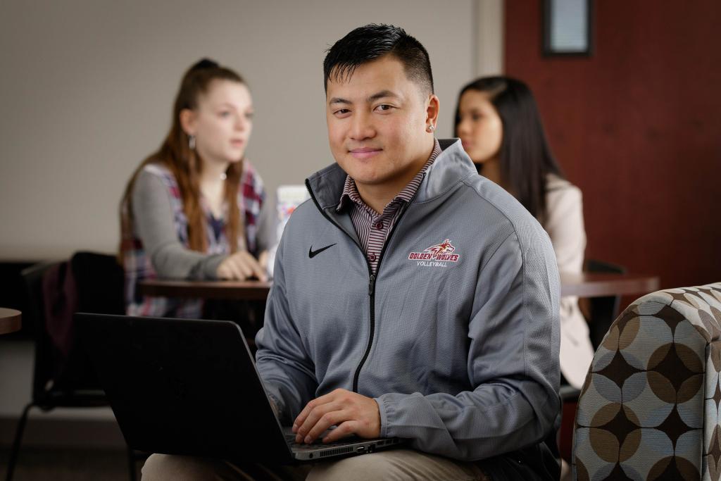 Male graduate student at laptop