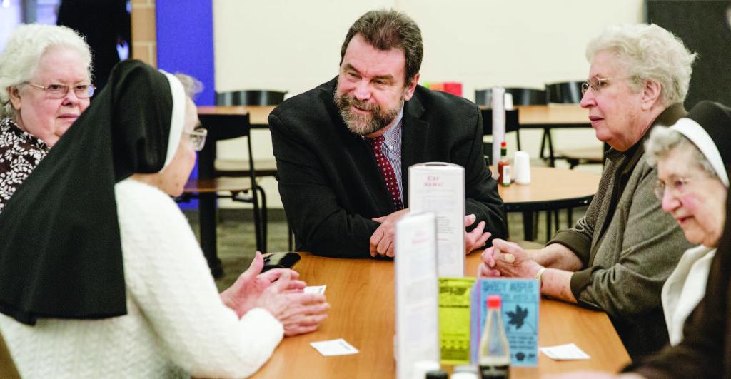 Alvernia President Tom Flynn talks with the Bernardine Franciscan Sisters