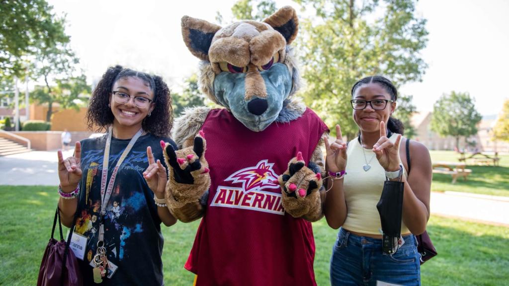 Alvernia University students with Golden Wolf Mascot