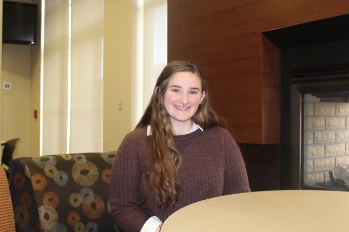 Addictions & Mental Health student Maria Checchia sitting in chair