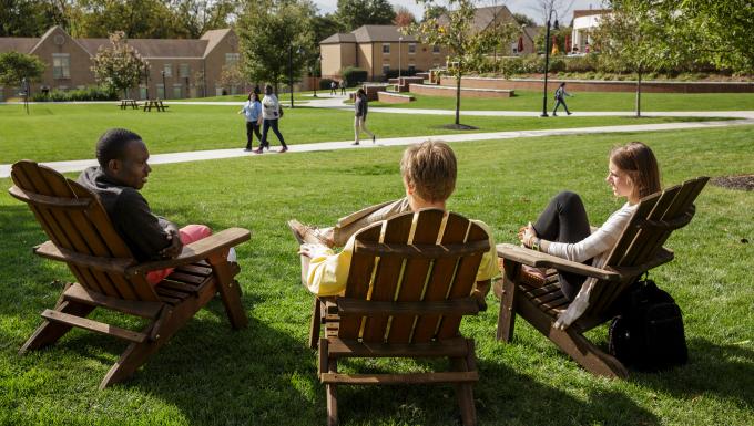 Students in Adirondack chairs
