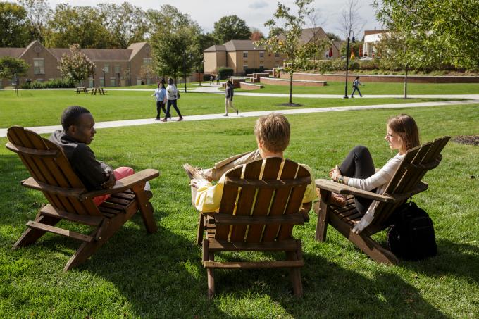 Students in Adirondack chairs