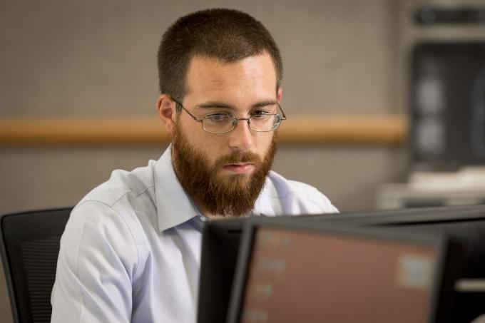 Grad assistant works in library