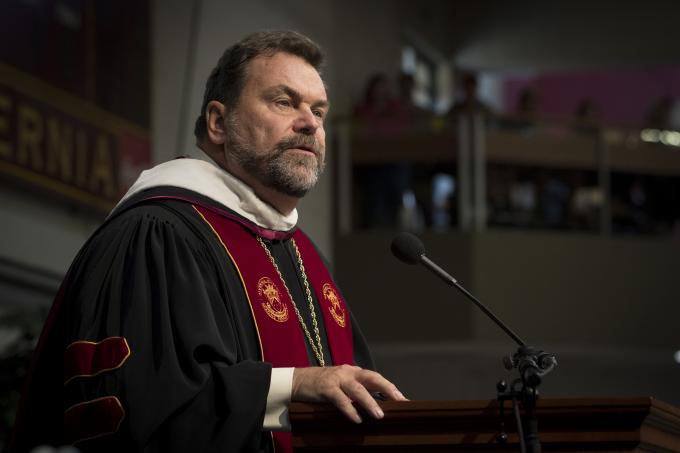 President Flynn speaking at convocation