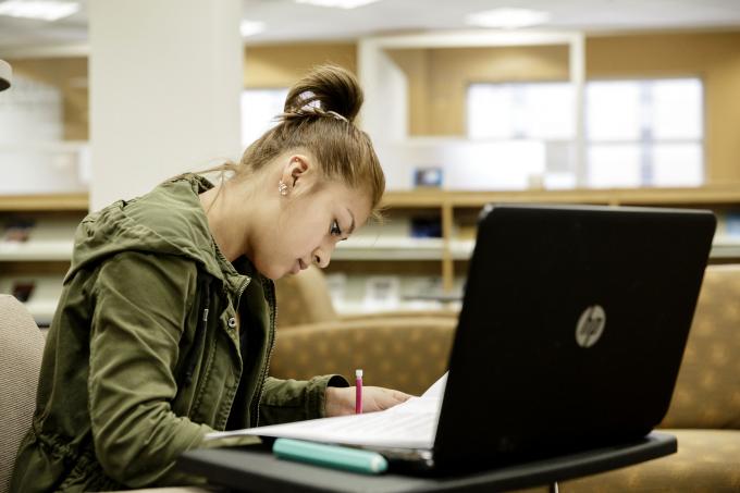 Female graduate student at laptop