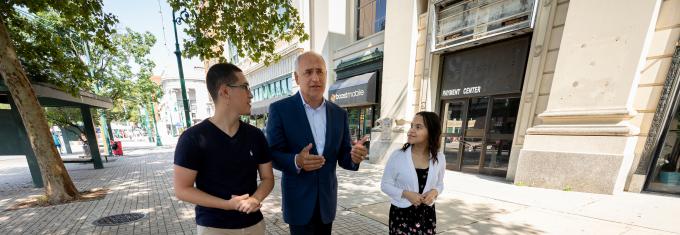 President Loyack walking with student in downtown Reading, Pa.