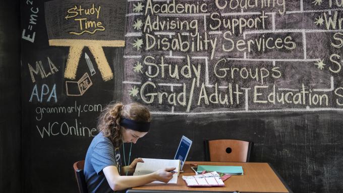 Student uses Bernardine Hall lounge to study