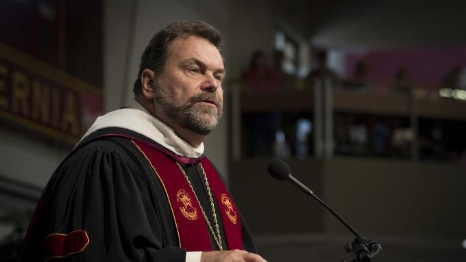 President Flynn speaking at convocation