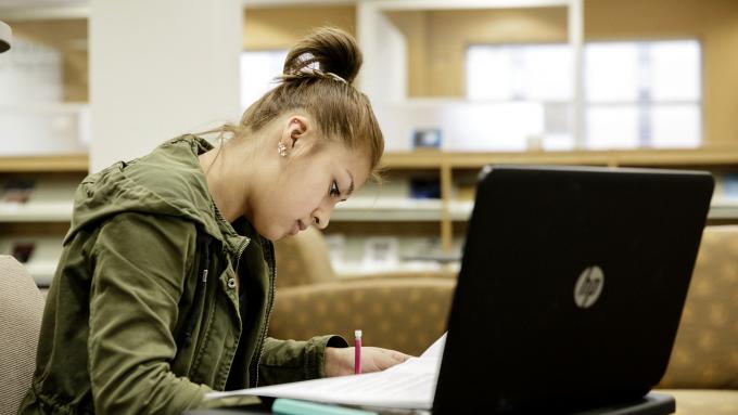 Female graduate student at laptop