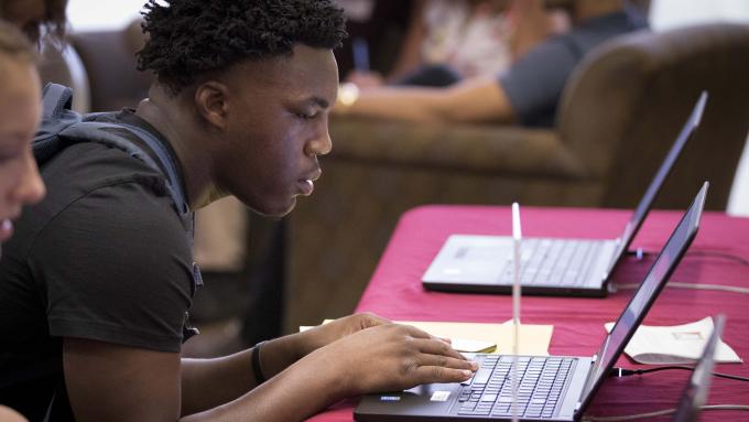 Student working at laptop
