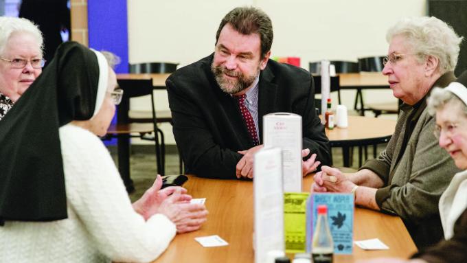 Alvernia President Tom Flynn talks with the Bernardine Franciscan Sisters