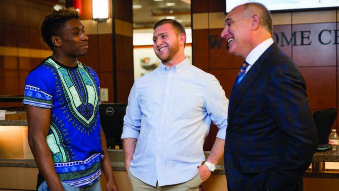 Alvernia President John Loyack converses with students