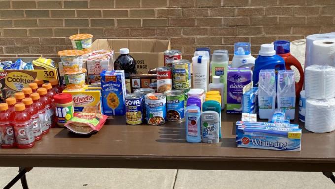 Clare's Cupboard food donation on table.