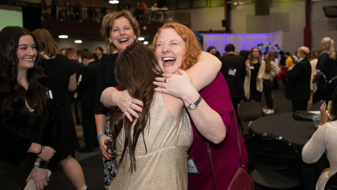 Alvernia University President Glynis A. Fitzgerald volunteers at a Night to Shine event.